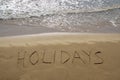 Holidays written in sand Royalty Free Stock Photo